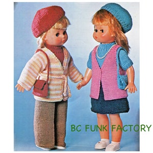 May include: Two dolls wearing knitted outfits. The doll on the left is wearing a pink and white striped cardigan, brown pants, and a red beret. The doll on the right is wearing a blue knitted vest, a pink sweater, a blue skirt, and a blue beret. Both dolls are holding small purses.