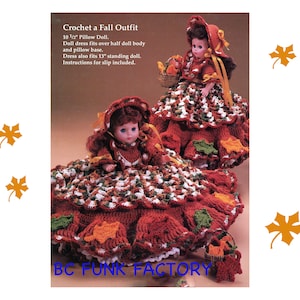 May include: Crochet pattern for a fall outfit for a 10 1/2 inch pillow doll. The dress is red, green, and white with a crocheted leaf design. The doll is wearing a red and white hat. The pattern includes instructions for a slip.