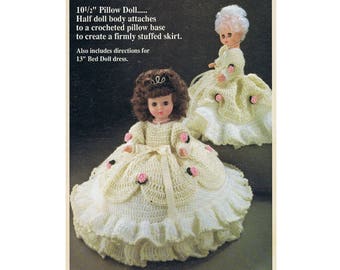 May include: Crochet pattern for a 10 1/2 inch pillow doll dress. The dress is white with pink flowers and a ruffled hem. The pattern also includes directions for a 13 inch bed doll dress.