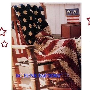 May include: A red, white, and blue crocheted blanket draped over a wooden rocking chair. The blanket features a star pattern and stripes.