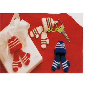 May include: Three sets of crocheted winter accessories. One set is red and white, one is green and white, and one is blue and white. Each set includes a hat and a pair of mittens.