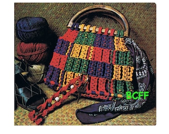 May include: A colorful crocheted bag with a wooden handle. The bag is made with red, yellow, green, and purple yarn. The bag is sitting on a woven mat with a bandana and yarn balls.
