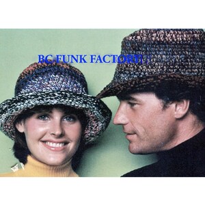 May include: Two crocheted hats, one in brown and black with a wide brim, and the other in blue, white, and purple with a smaller brim.