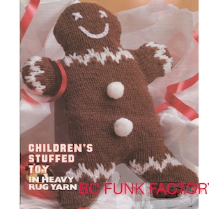 May include: Knit gingerbread man toy with white trim and buttons. The toy is made with heavy rug yarn and is a children's stuffed toy. The text on the image reads "Children's Stuffed Toy In Heavy Rug Yarn BC FUNK FACTORY".