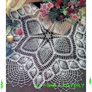 May include: White crocheted doily with a delicate floral design. The doily is circular and has a scalloped edge.
