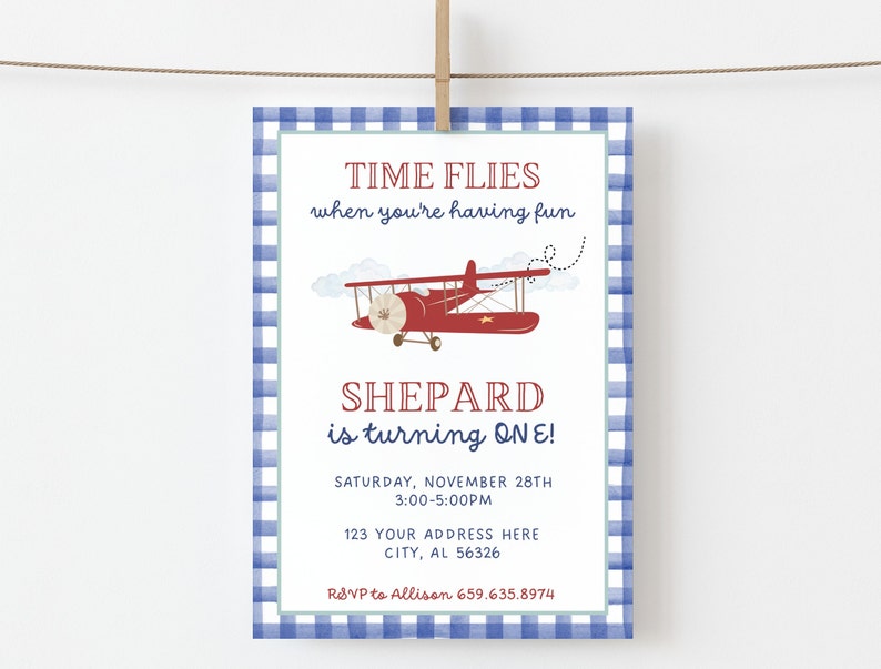 May include: A blue and white gingham patterned invitation with a red airplane illustration. The text reads "TIME FLIES when you're having fun SHEPARD is turning ONE! SATURDAY, NOVEMBER 28TH 3:00-5:00PM 123 YOUR ADDRESS HERE CITY, AL 56326 RSVP to Allison 659.635.8974"