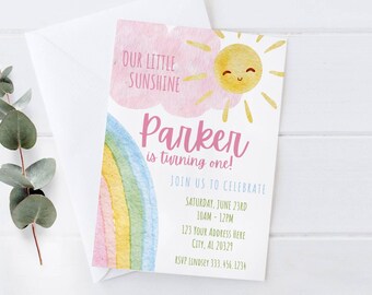 May include: A pink and yellow birthday invitation with a rainbow and a sun with a smiling face. The text reads "Our little sunshine Parker is turning one!" and includes details for the party.