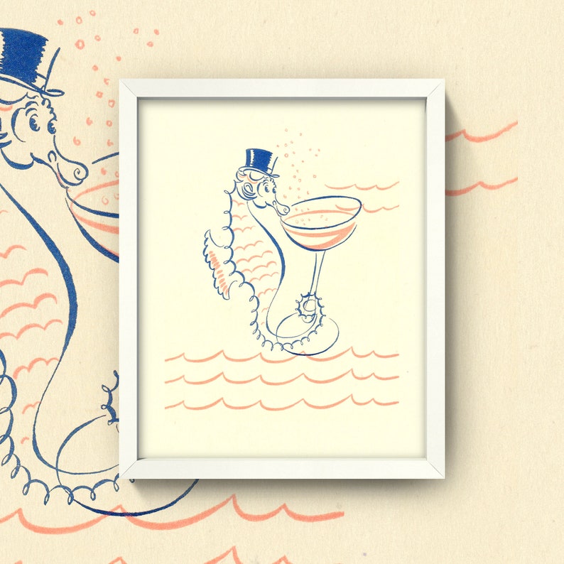 May include: A white framed print of a cartoon seahorse wearing a top hat and drinking from a champagne glass. The seahorse is blue and white, and the background is a light yellow with pink waves.