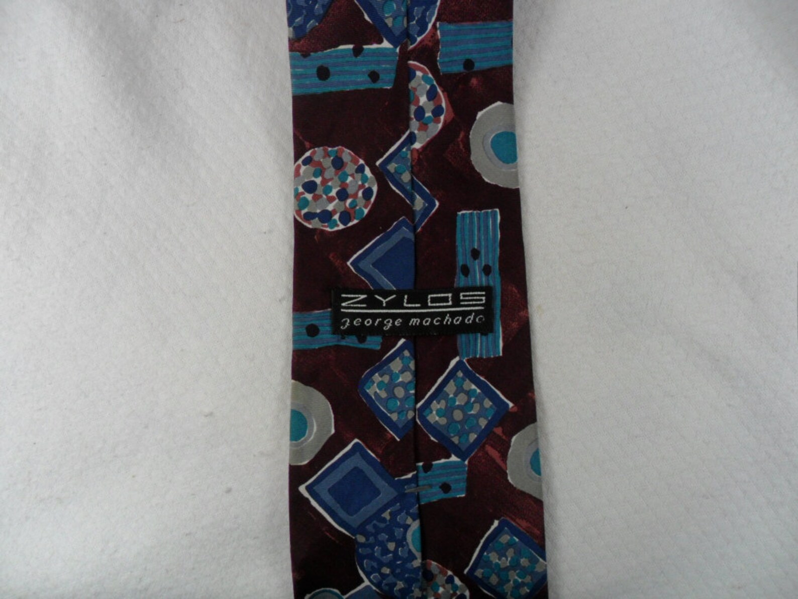 zylos george machado tie