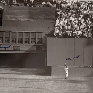 May include: A black and white photo of a baseball player hitting a ball. The player is wearing a white uniform with the number 24 on it. The photo is signed "Jim Rice".