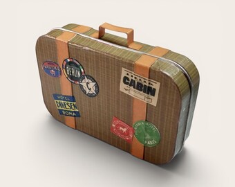 May include: A vintage-style brown suitcase with orange and green accents. The suitcase has several travel stickers, including "Paris Liege", "Berlin", and "Cabin". It features a brown handle and is designed for travel.