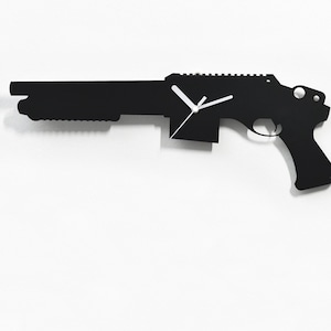 May include: Black silhouette of a shotgun clock on a white wall. The clock hands are white. The text "By Sol Pixie Dust" is at the bottom of the image.