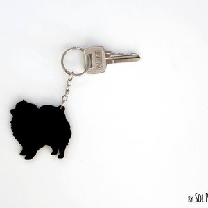 Silueta de llavero de perro Pomerania
