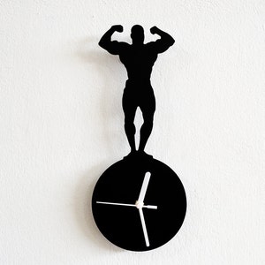 Mr Universe Silueta Delantera Doble Bíceps - Reloj de Pared
