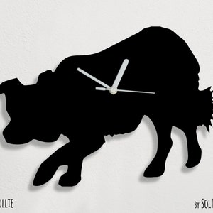 May include: Black silhouette of a Border Collie dog, used as a clock face. The clock hands are white. The text "BORDER COLLIE" is at the bottom left of the image. The text "BY SOL PIXIE DUST" is at the bottom right of the image.