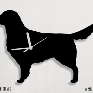 May include: Black silhouette of a Golden Retriever dog with white clock hands. The clock is labeled "Golden Retriever" and "By Sol Pixie Dust".