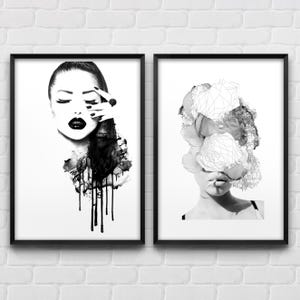 May include: Two black and white framed prints. The print on the left features a woman's face with her eyes closed and a hand covering one eye. The print on the right features a woman's face with a geometric design covering her face.