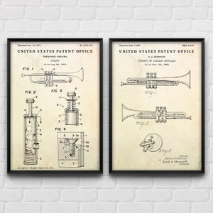 May include: Two vintage United States Patent Office drawings for trumpet designs. The left drawing shows a trumpet with a detailed diagram of the valve mechanism. The right drawing shows a trumpet with a simple design.
