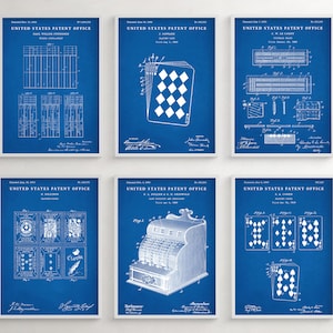 May include: A set of six blue patent prints featuring various designs, including a playing card, a cash register, and a grid pattern. The prints are framed in white and have the text "United States Patent Office" at the top.