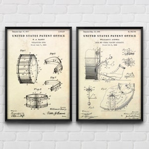 May include: Two vintage black and white patent drawings for musical instruments. The left drawing shows a collapsible drum with a patent date of 17th April 1917. The right drawing shows a drum and cymbal playing apparatus with a patent date of 25th May 1909.