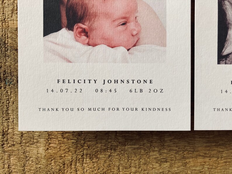 May include: A white card with black text announcing the birth of Felicity Johnstone. The card includes the date of birth, time of birth, and weight of the baby: 14.07.22, 08:45, 6lb 2oz. The text "Thank you so much for your kindness" is also included.