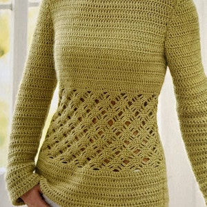 May include: A green crocheted sweater with a lacy design around the waist.