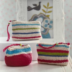 May include: Three handmade crochet coin purses in various shapes and sizes. The purses feature horizontal stripes in red, blue, green, and cream colors. Each purse has a matching tassel and a small bead attached to the zipper.