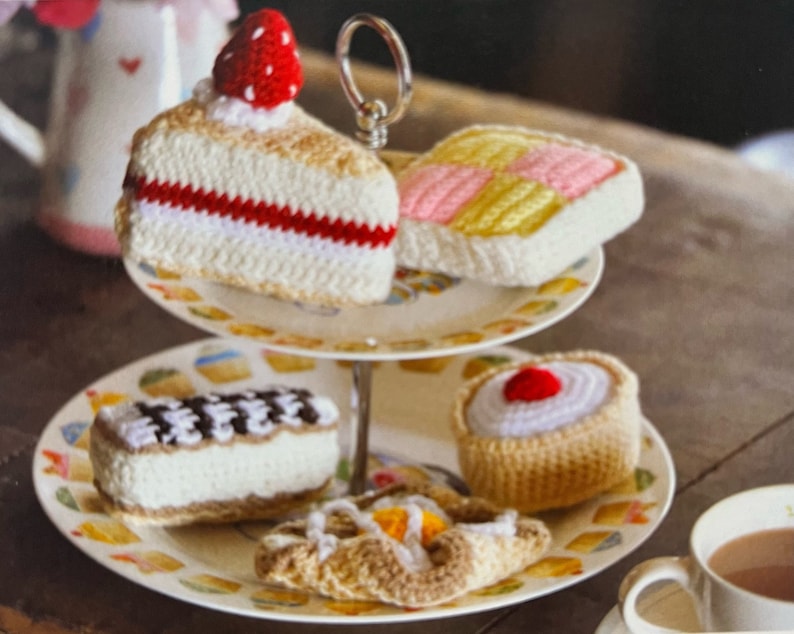This is a crochet pattern for making five different tea cakes with this sweet yarn design