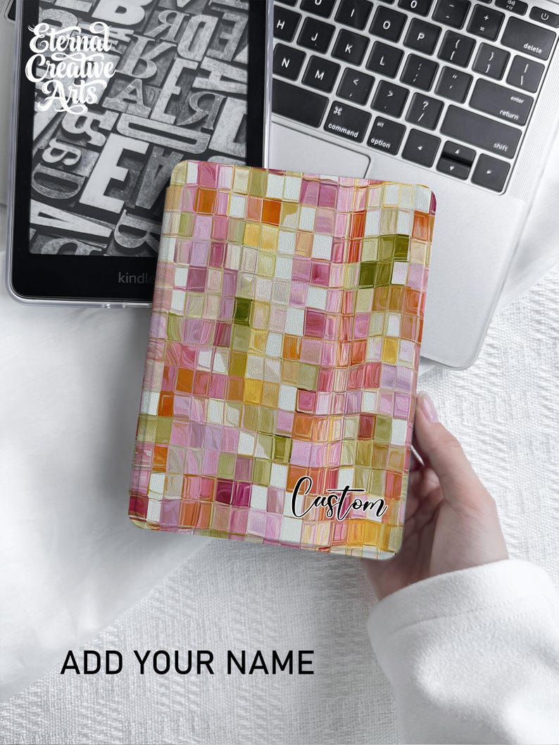 May include: A rectangular e-reader case featuring a mosaic pattern of pink, orange, yellow, and olive green squares. The case includes a white rectangular label in the bottom right corner with the word Custom printed in black script font.