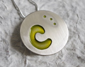 Sterling silver necklace with green resin.