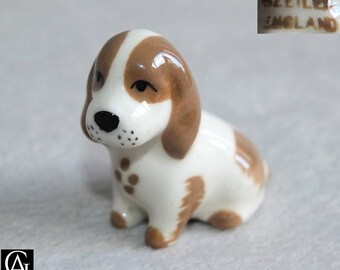 Vintage Szeiler miniature Spaniel sitting Puppy Brown and White Ceramic dog Figurine c.1960s