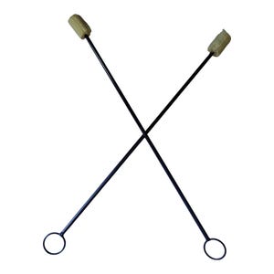 May include: Two long, thin black metal rods crossed in an X shape. Each rod features a circular ring at the bottom end and a cylindrical, textured beige wick head at the top end, designed for fire performance activities and spinning maneuvers.