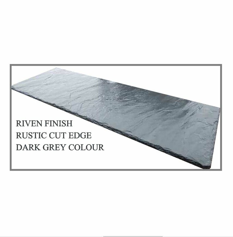 May include: Dark grey slate tile with a riven finish and rustic cut edge.  The tile is rectangular and has a natural stone texture.
