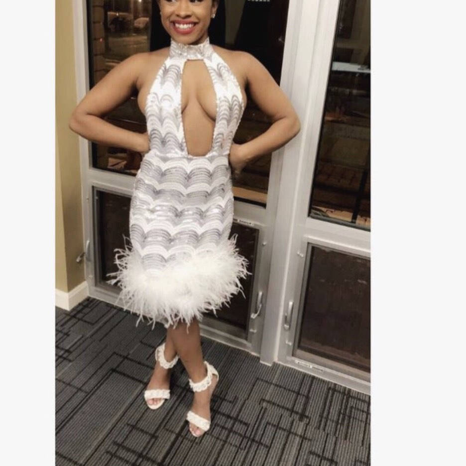 white sequin dress with feathers