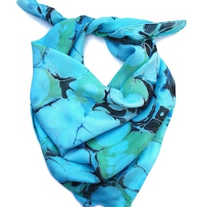 Large silk square scarf marbled in blue, turquoise and black.