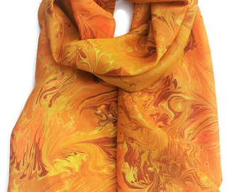 Bright yellow and orange silk marbled scarf with brown and yellow ochre.