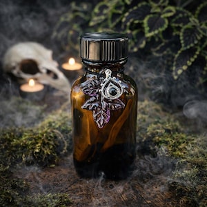 HEATHEN MIST Spell Oil. Mysterious Scent of Allure. Witch Rituals. Essential Oils. Apothecary Bottle. Sterling Silver Glass Leaf.  8 Dram