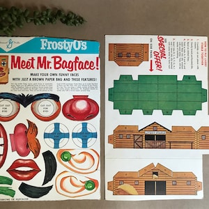 Pudełko płatków śniadaniowych Mr. Bagface firmy Frosty-O + wycinana stajnia / książka podróżnicza Twinkles, papierowe lalki z Londynu