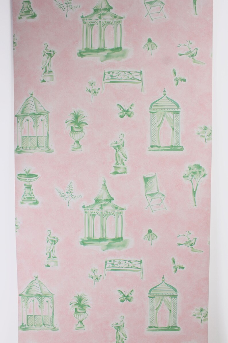 May include: A pink and green wallpaper pattern featuring a repeating design of gazebos, benches, urns, birds, butterflies, and other garden elements.