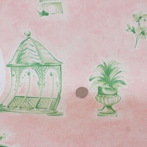 May include: Pink wallpaper with a green and white gazebo, a green potted plant, and green floral designs.