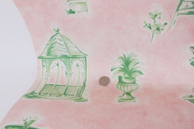 May include: Pink wallpaper with a green and white gazebo, a green potted plant, and green floral designs.