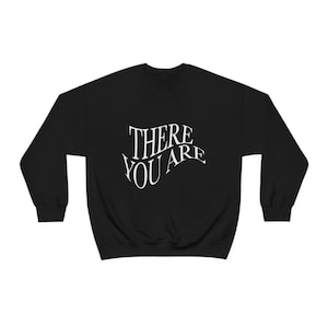 May include: Black sweatshirt with white text that reads "THERE YOU ARE" in a stylized font.