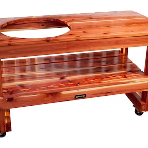 May include: A wooden table with a round cutout for a grill, a lower shelf, and wheels. The table is made of cedar wood and has a natural reddish-brown color. The table has a "JJ George" logo on the front.