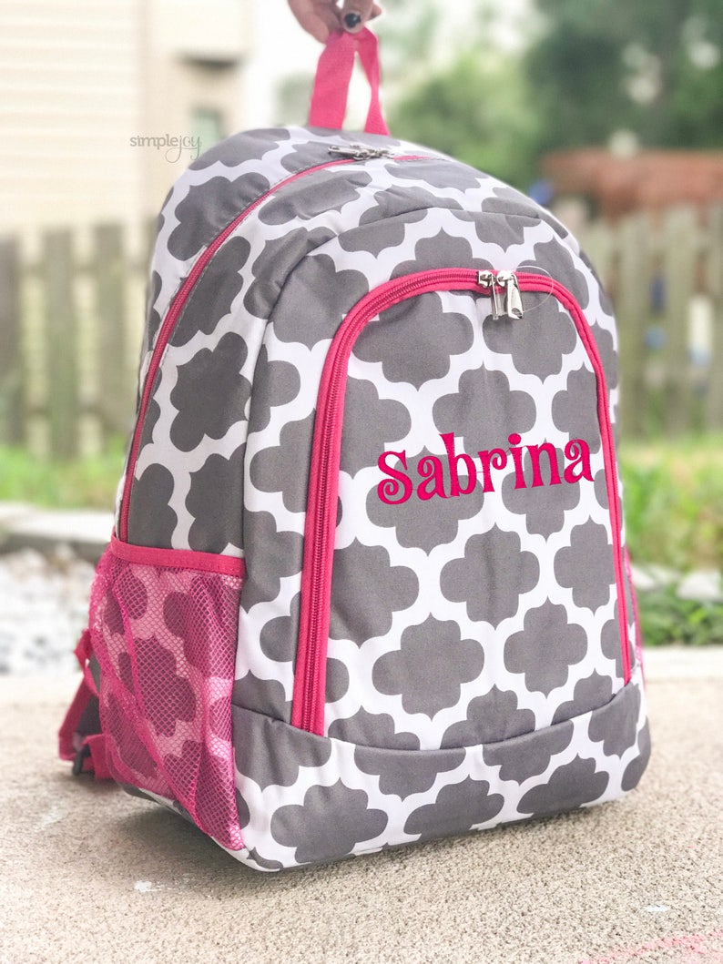 pink and turquoise backpack