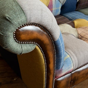 3 seater Patchwork Chesterfield Sofa. Shown in a range of multi coloured wool blend fabrics with contrasting antique tan leather details.