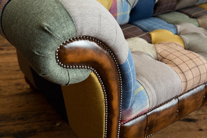 3 seater Patchwork Chesterfield Sofa. Shown in a range of multi coloured wool blend fabrics with contrasting antique tan leather details.