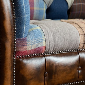 3 seater Patchwork Chesterfield Sofa. Shown in a range of multi coloured wool blend fabrics with contrasting antique tan leather details.