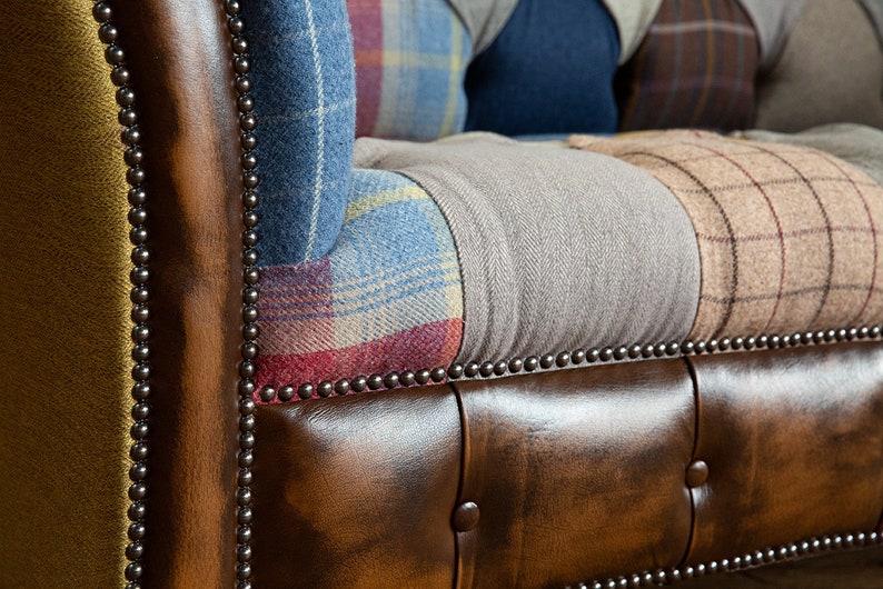 3 seater Patchwork Chesterfield Sofa. Shown in a range of multi coloured wool blend fabrics with contrasting antique tan leather details.