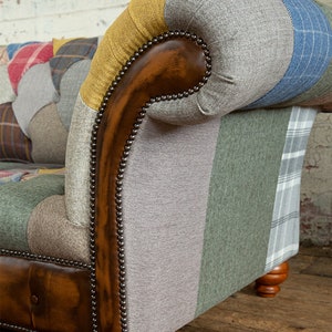 3 seater Patchwork Chesterfield Sofa. Shown in a range of multi coloured wool blend fabrics with contrasting antique tan leather details.