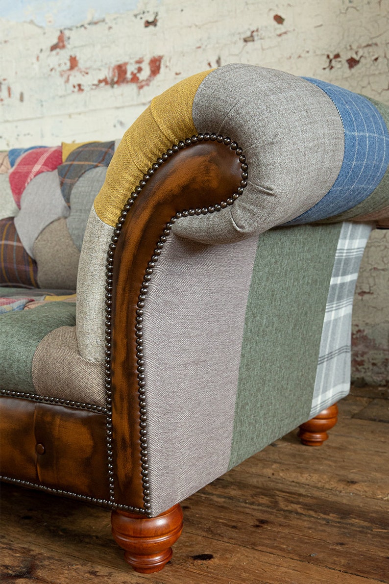 3 seater Patchwork Chesterfield Sofa. Shown in a range of multi coloured wool blend fabrics with contrasting antique tan leather details.